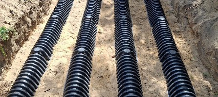 Rows of drainfield chambers installed before backfill