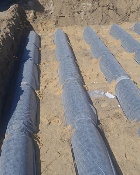 Drainfield lines wrapped and ready for backfill