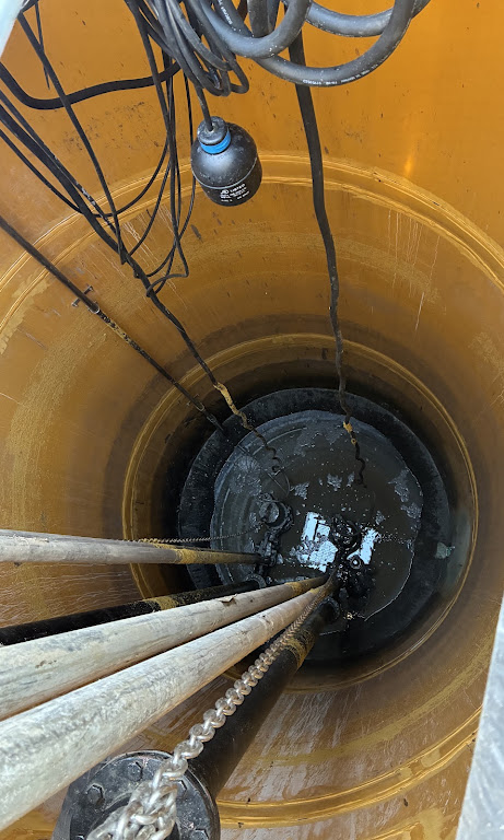 Inside a lift station pit during service