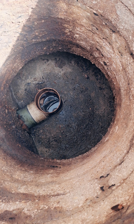 Outlet baffle checked inside a septic tank during inspection