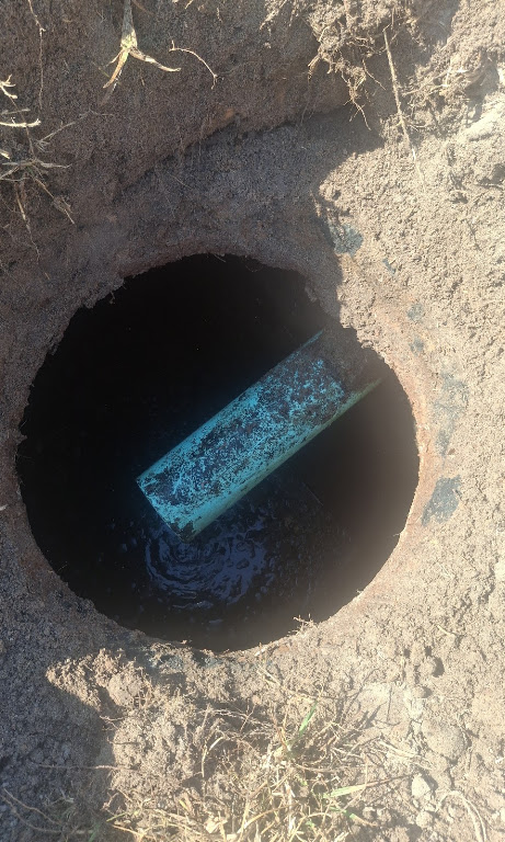 Septic tank lid opened for inspection