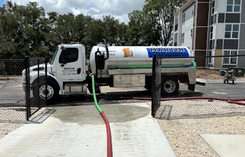 Martin Septic truck at a commercial pump-out with the hoses run out